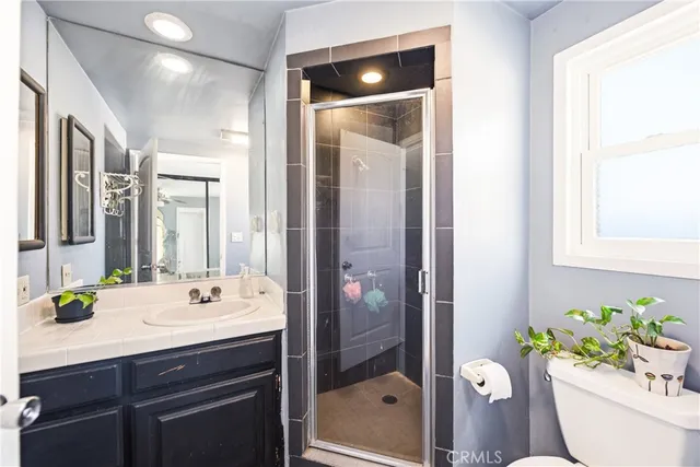 a bathroom with a sink vanity and a mirror