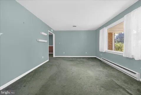 a utility room with cabinets washer and dryer