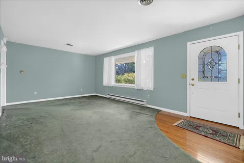 a kitchen with a sink a stove and cabinets