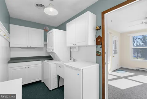 a view of an empty room with storage