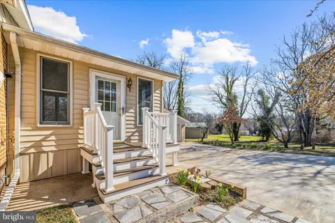 an empty room with a fireplace and painted walls