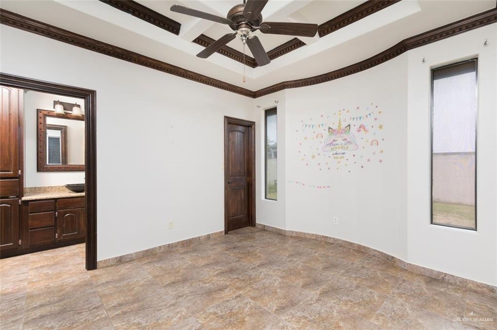 208 Thornwood Loop Rio Grande City, TX 78582 - Photo 11 of 21 a view of a hallway and a chandelier fan