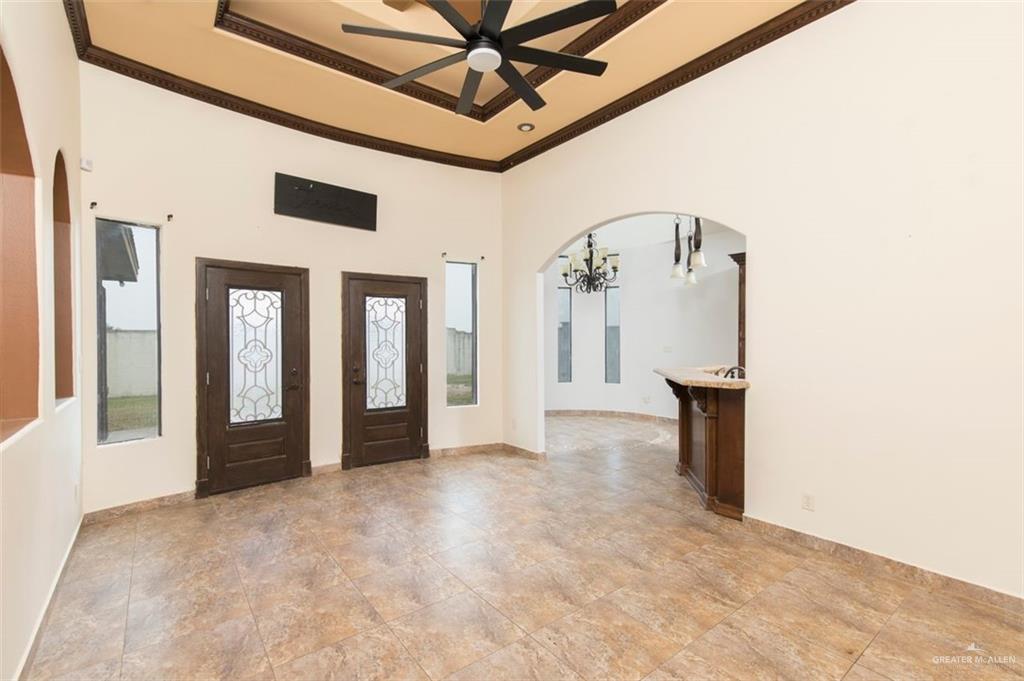 208 Thornwood Loop Rio Grande City, TX 78582 - Photo 7 of 21 a view of a hallway with wooden floor and entryway