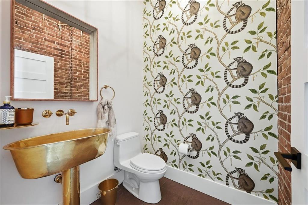 443 Walnut Street Sewickley, PA 15143 - Photo 17 of 50 The powder room is an unforgettable design moment, highlighted by the custom solid brass Moroccan sink.