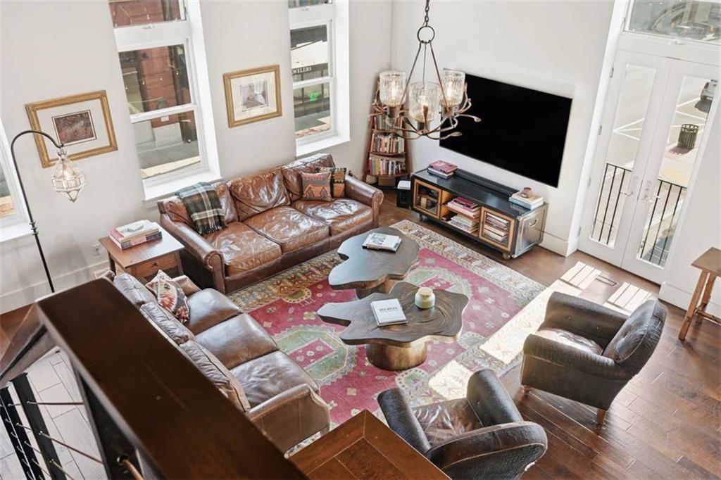 443 Walnut Street Sewickley, PA 15143 - Photo 23 of 50 An elevated view from the Loft headed upstairs underscores the volume and light of the central gathering space.