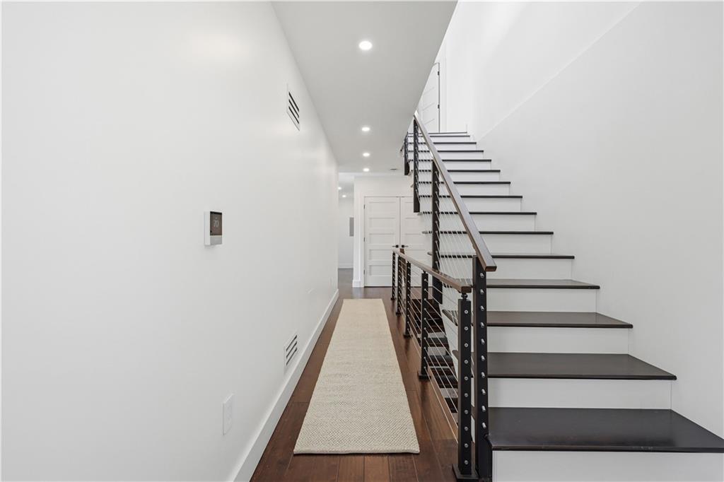 443 Walnut Street Sewickley, PA 15143 - Photo 39 of 50 Both functional and architectural, the staircase is finished with dark wood treads, cable railing, and a streamlined design that complements the home’s loft-like character.