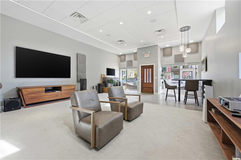 443 Walnut Street Sewickley, PA 15143 - Photo 49 of 50 From this angle, the commercial suite feels especially inviting, with its street-facing windows, warm wood entry door, and generous open area that easily accommodates both client seating and display space.