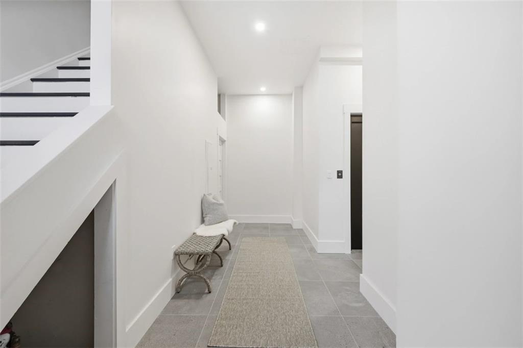 443 Walnut Street Sewickley, PA 15143 - Photo 6 of 50 A welcoming entry hall connects the residence with ease, offering both stair and elevator access.
