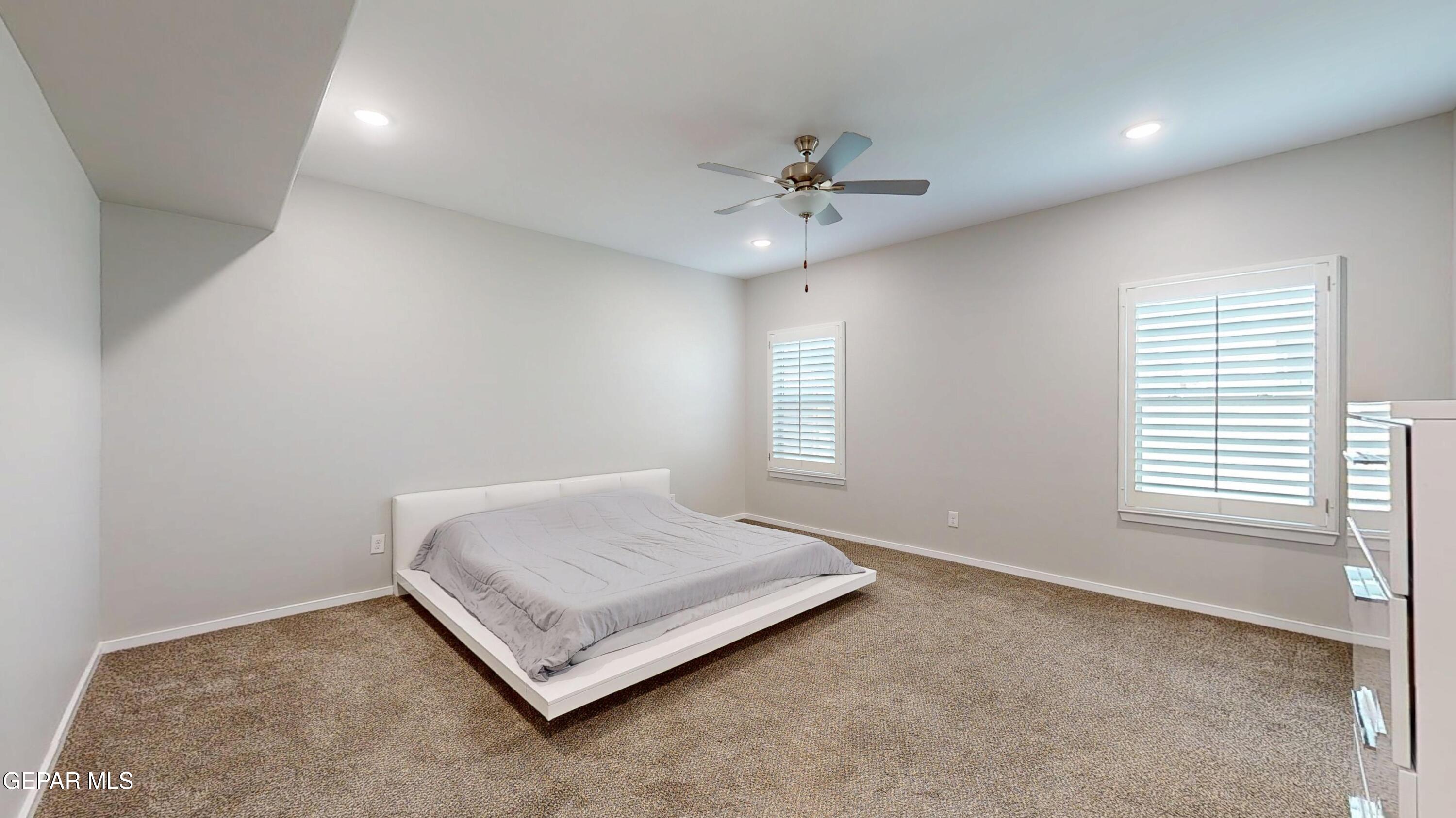 219 Notts Way El Paso, TX 79928 - Photo 15 of 35 a spacious bedroom with a bed and a window
