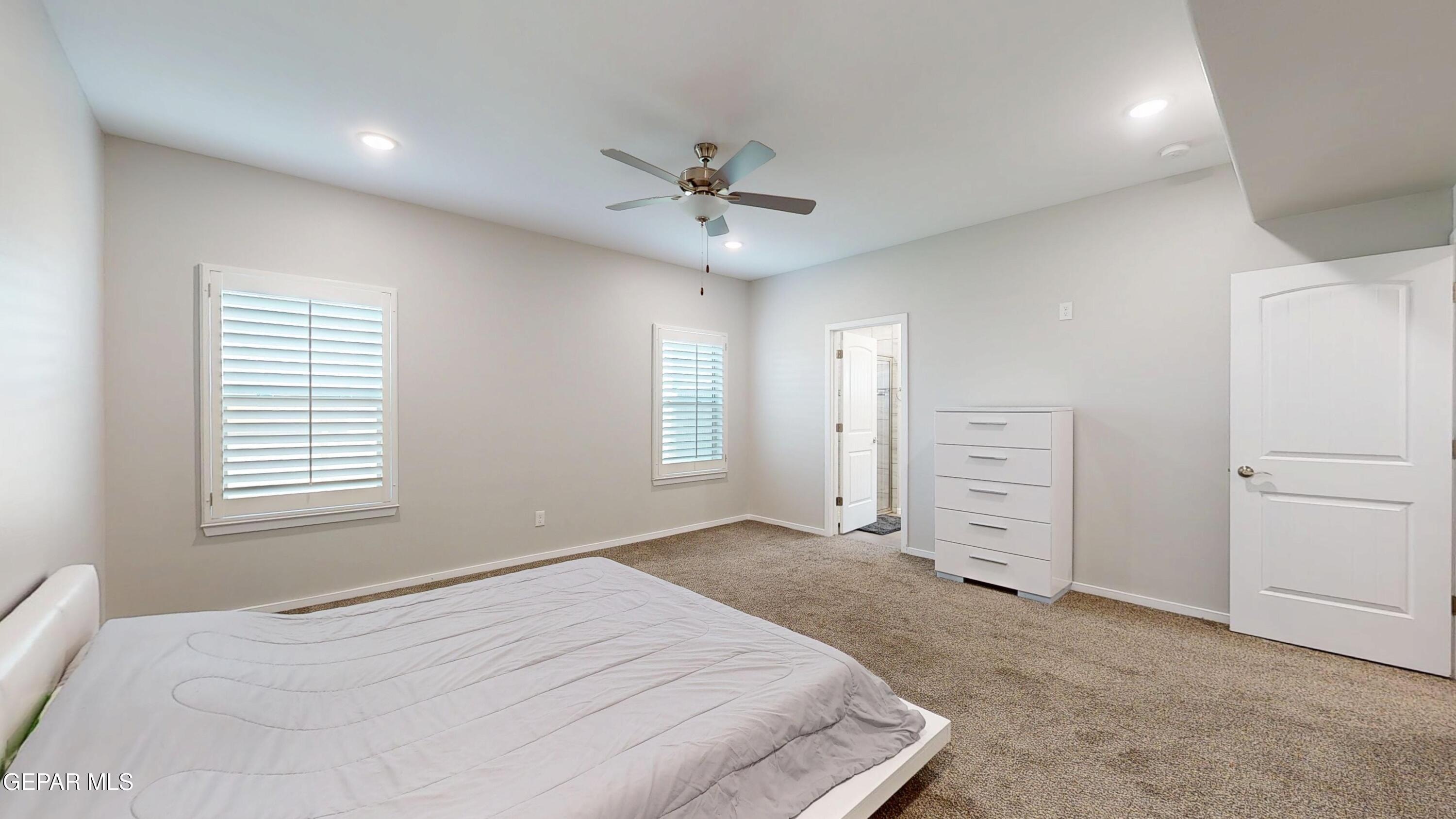 219 Notts Way El Paso, TX 79928 - Photo 18 of 35 a bedroom with a bed and a ceiling fan