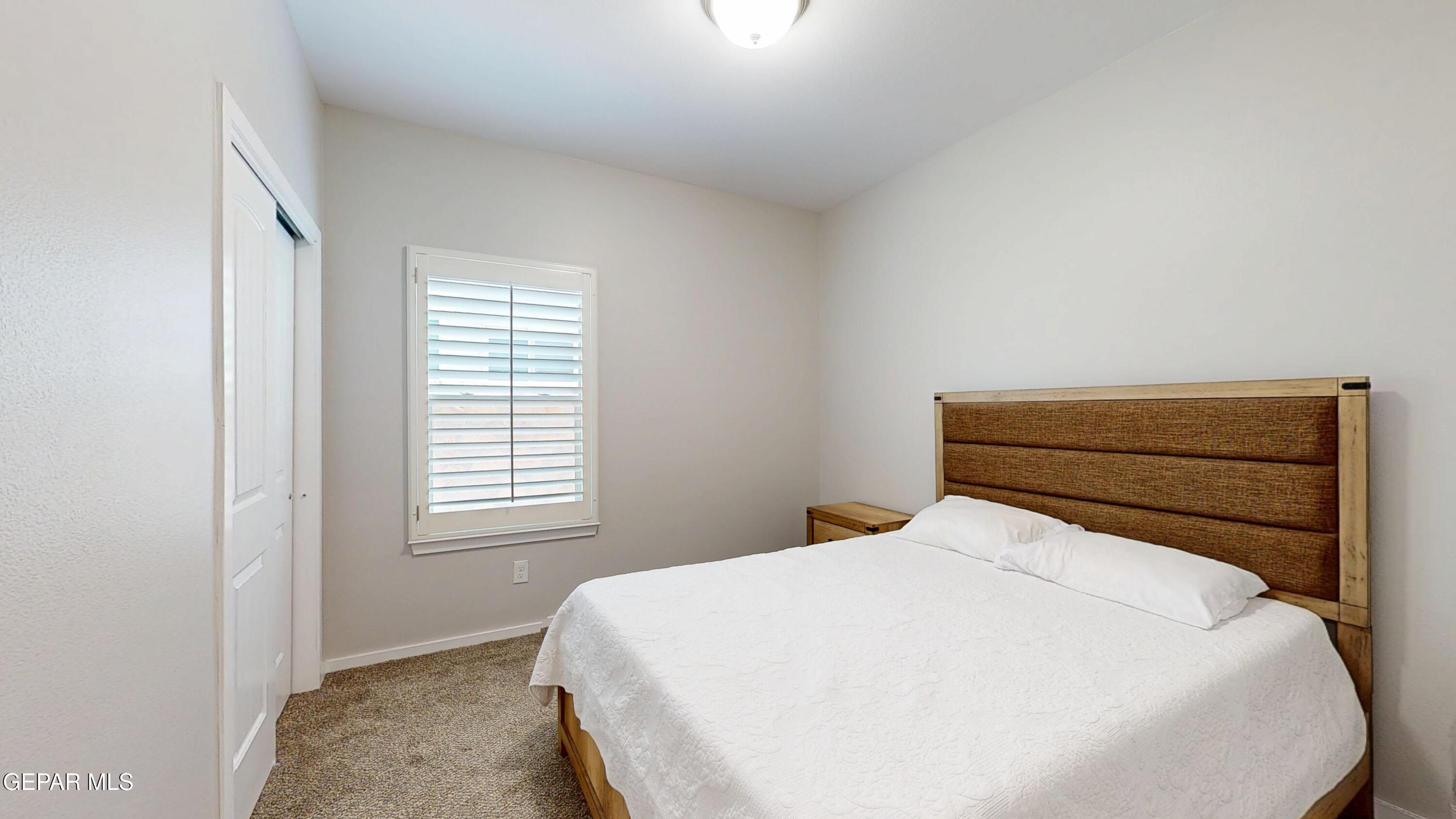 219 Notts Way El Paso, TX 79928 - Photo 25 of 35 a bed sitting in a bedroom next to a window