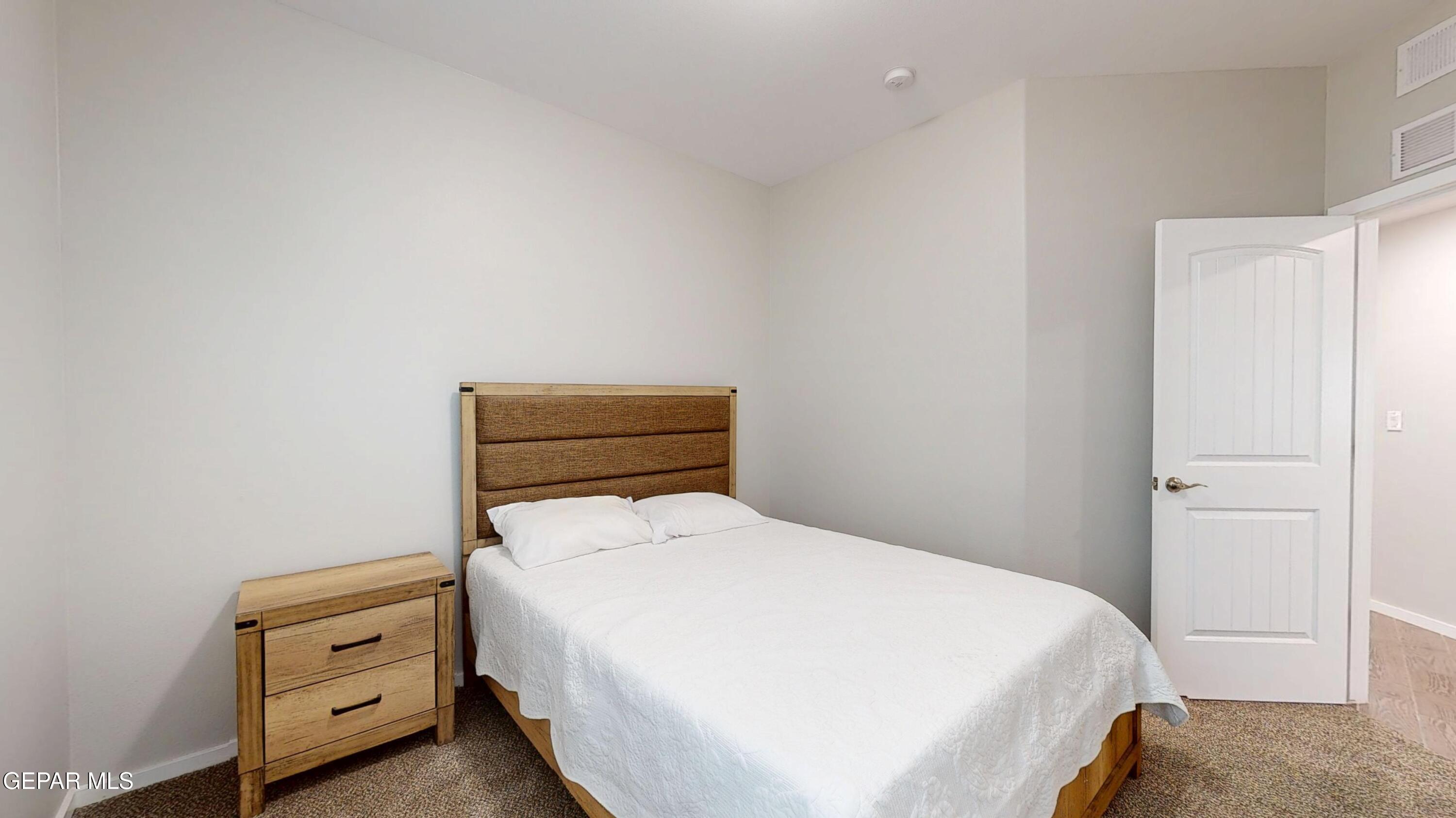 219 Notts Way El Paso, TX 79928 - Photo 26 of 35 a bedroom with a bed and a cabinets