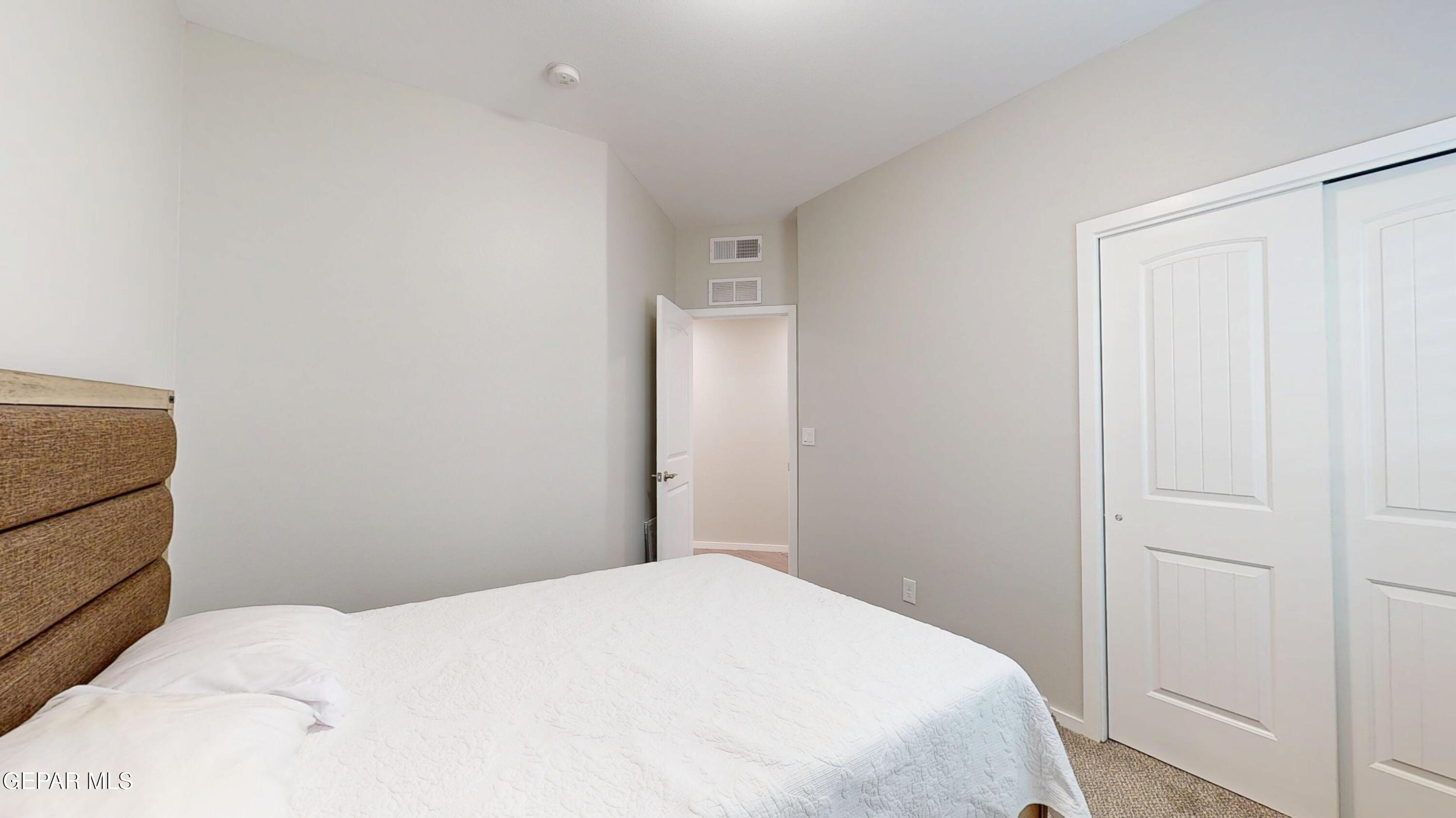 219 Notts Way El Paso, TX 79928 - Photo 27 of 35 a bedroom with a bed and a mirror