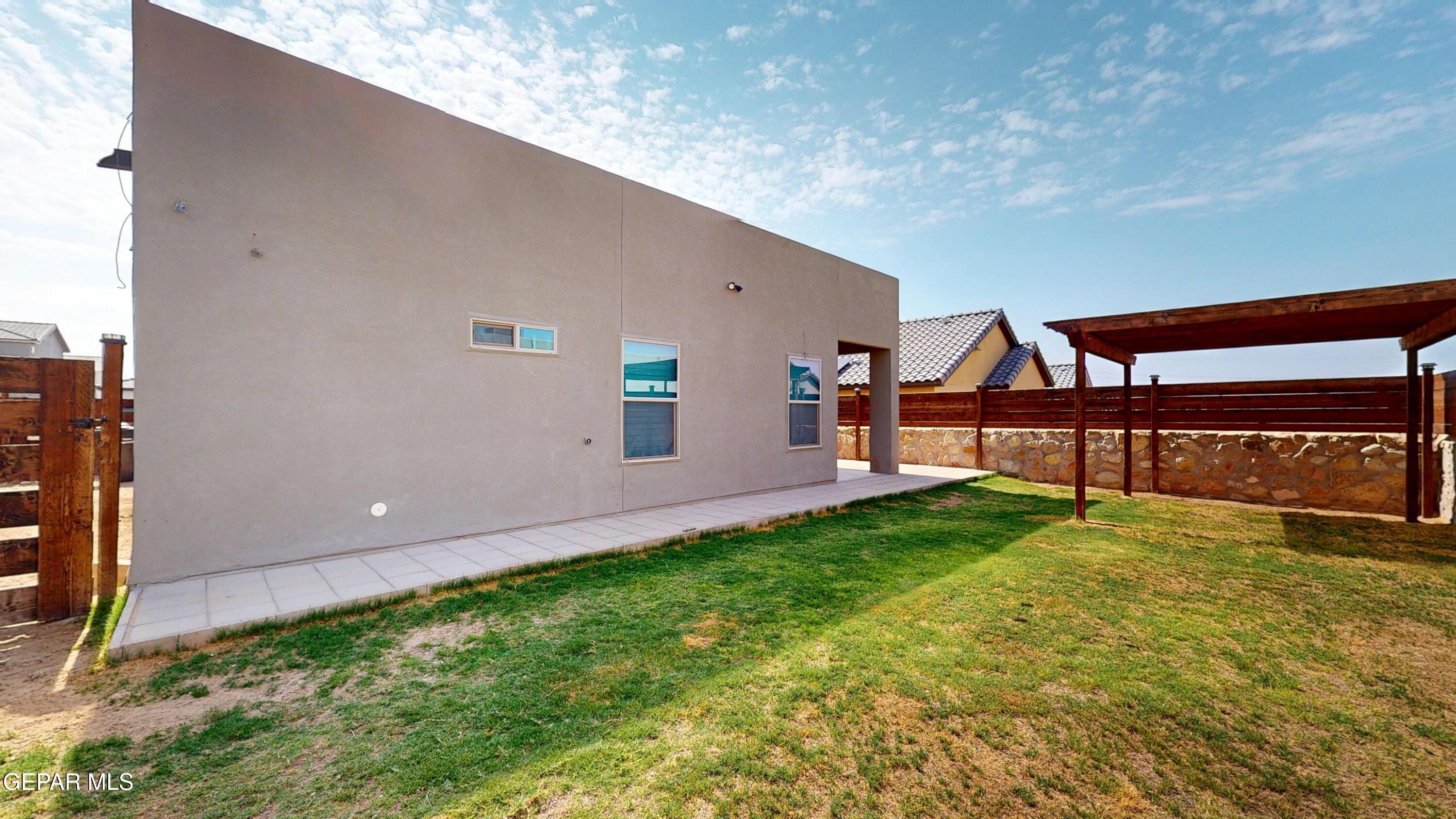 219 Notts Way El Paso, TX 79928 - Photo 4 of 35 a view of an house with backyard and garden