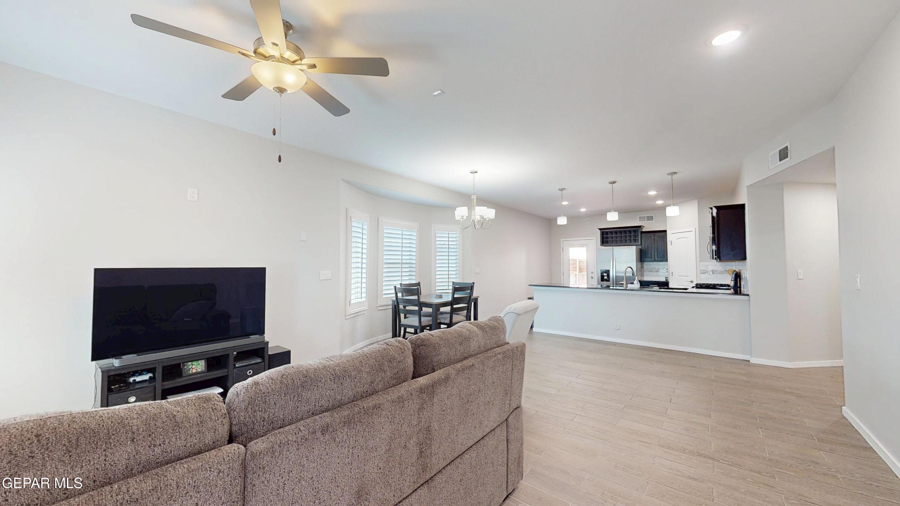 219 Notts Way El Paso, TX 79928 - Photo 5 of 35 a living room with furniture and a flat screen tv