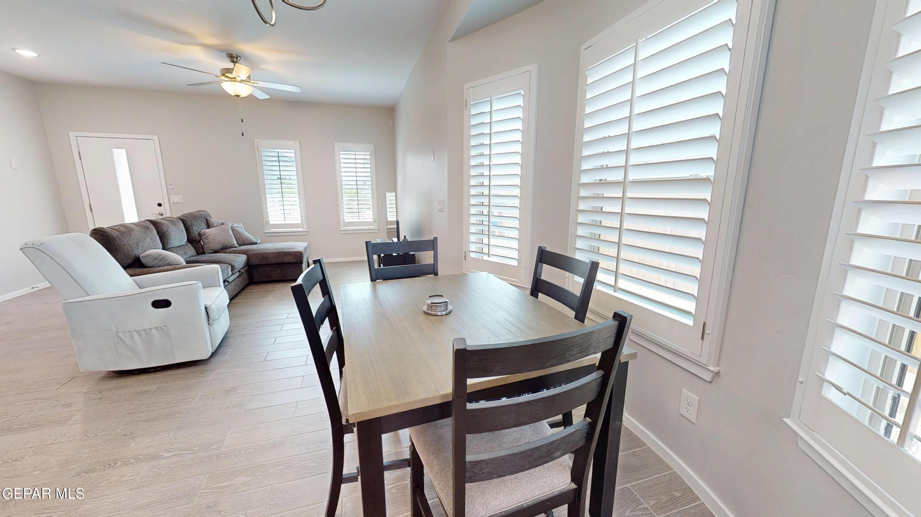 219 Notts Way El Paso, TX 79928 - Photo 8 of 35 a view of a dining room with furniture and a window