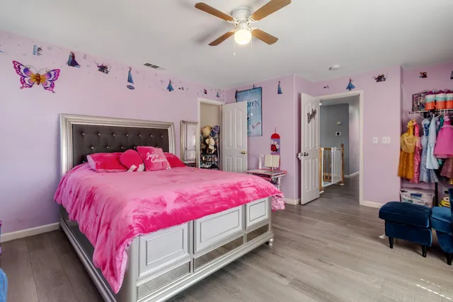 a bed room with a bed and a couch