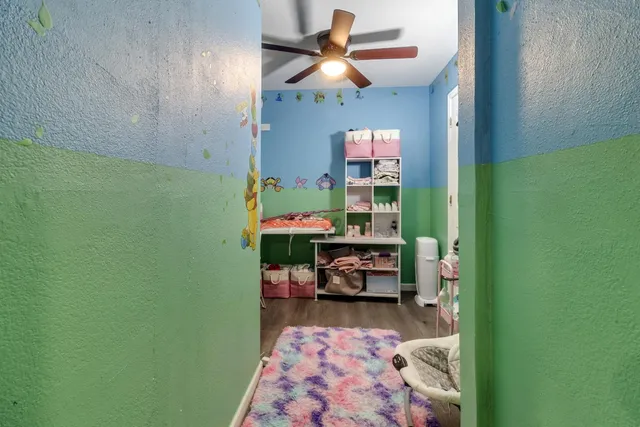 a dining room with furniture and a rug