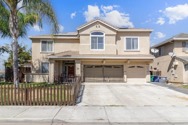 a front view of a house with a garage