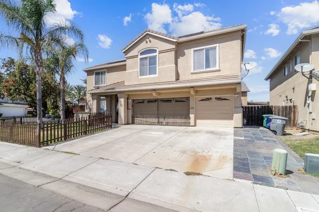 a front view of a house with a garage
