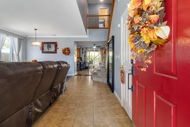 a hallway with a large mirror and a furniture