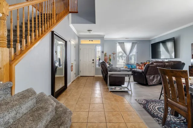 a bedroom with furniture and a window