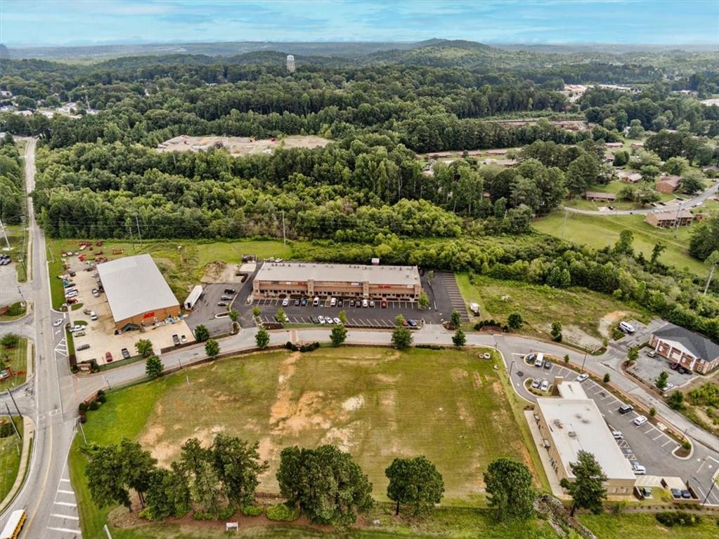 115 Village Walk Dallas, GA 30132 - Photo 3 of 16 an aerial view of a house with yard swimming pool and lake view