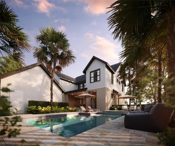 a front view of a house with garden and trees