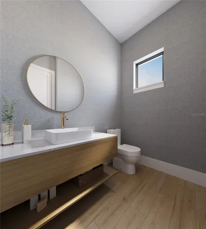 a bathroom with a toilet a sink and mirror