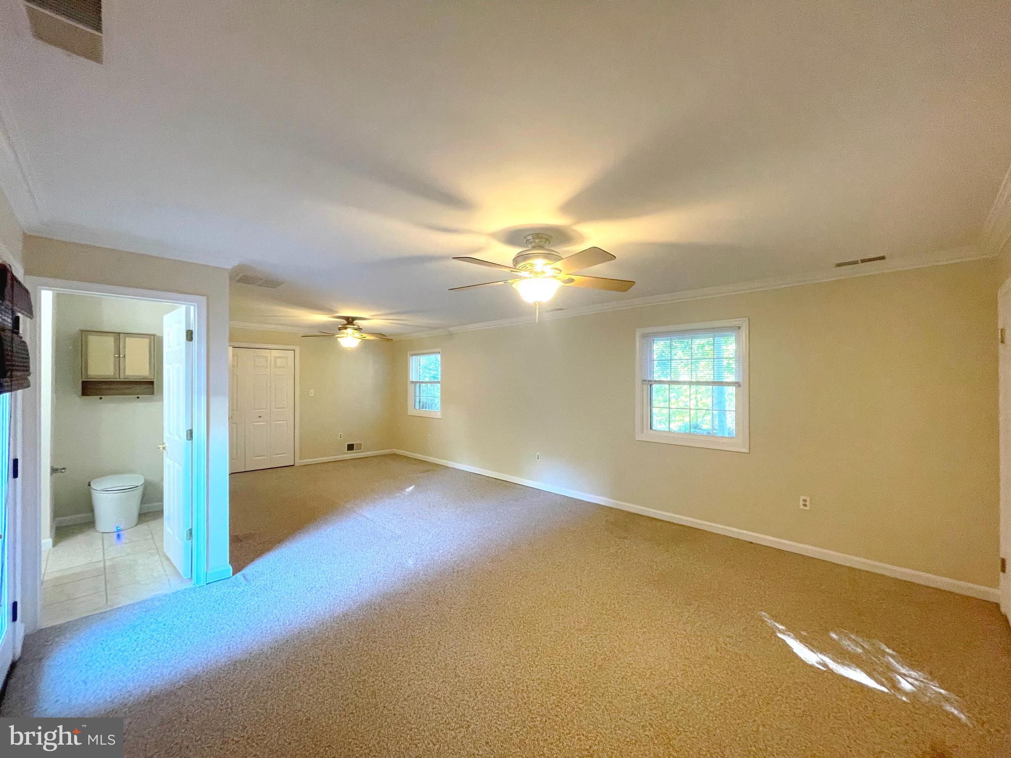 11717 Rivershore Drive Dunkirk, MD 20754 - Photo 29 of 49 an empty room with windows and bathroom view