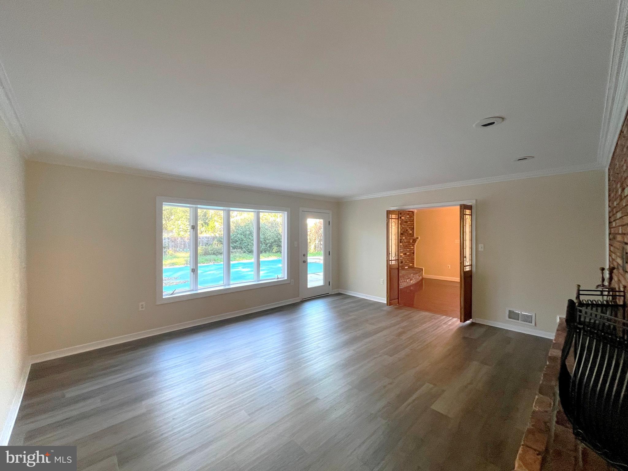 11717 Rivershore Drive Dunkirk, MD 20754 - Photo 4 of 49 an empty room with wooden floor and windows