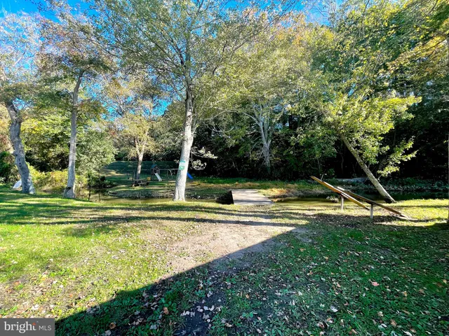 a view of a yard with swimming pool