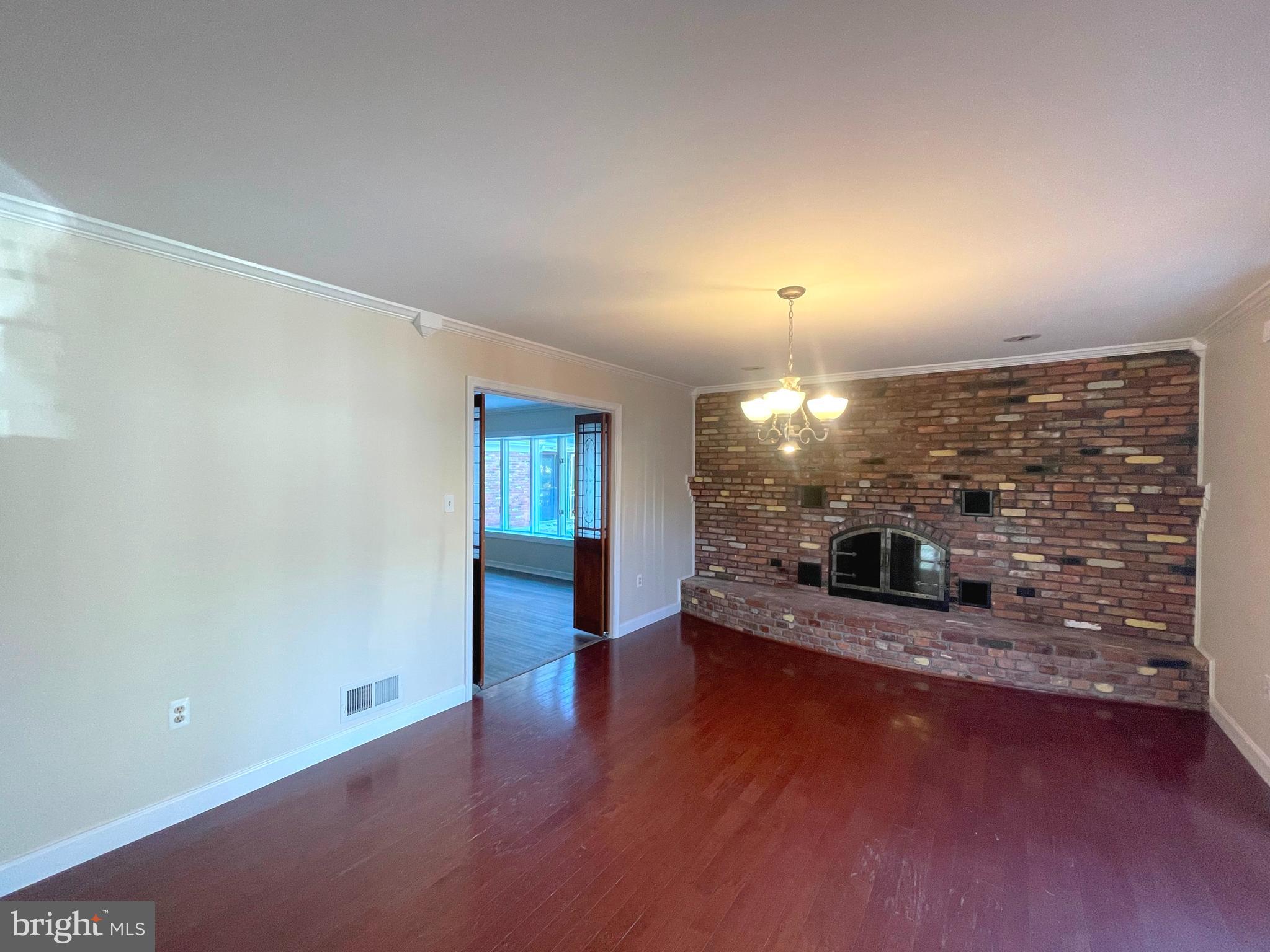 11717 Rivershore Drive Dunkirk, MD 20754 - Photo 5 of 49 an empty room with fireplace and windows
