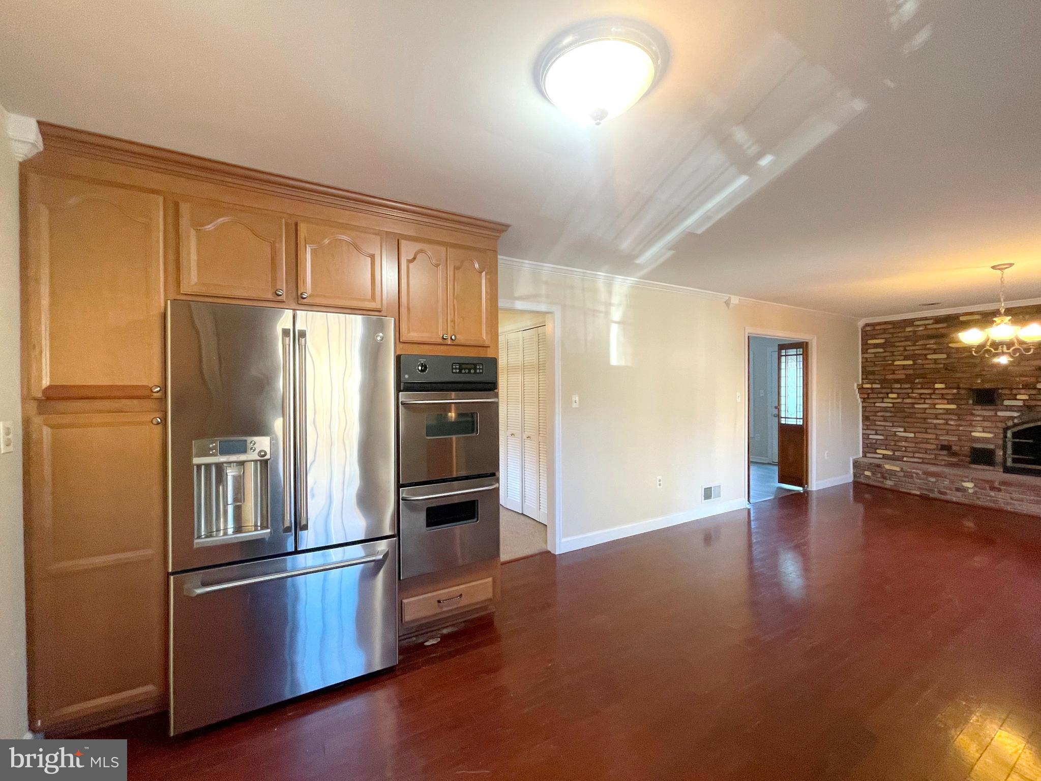 11717 Rivershore Drive Dunkirk, MD 20754 - Photo 10 of 49 a kitchen with stainless steel appliances a refrigerator and a stove top oven