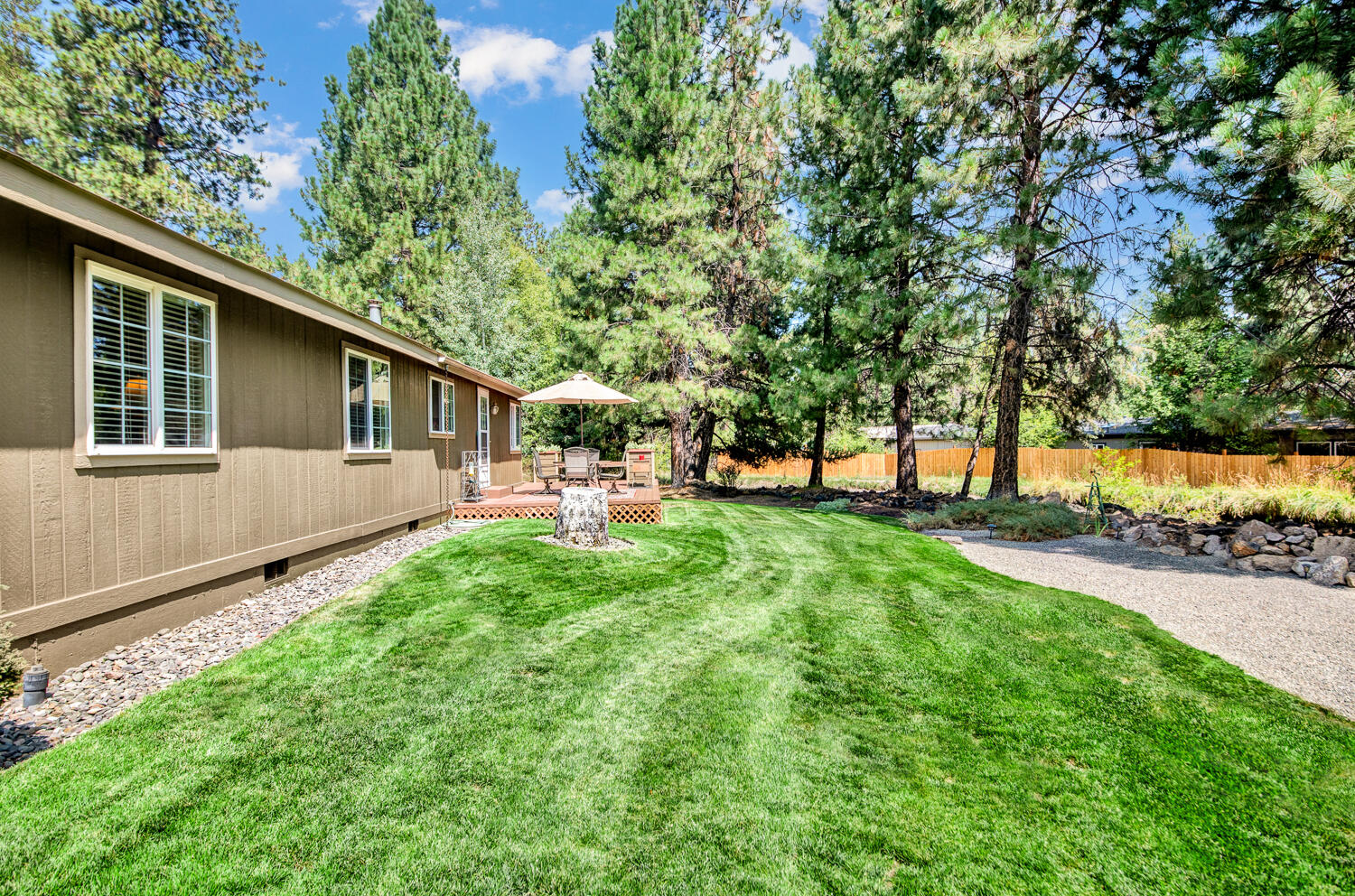19166 Choctaw Road Bend, OR 97702 - Photo 3 of 23 a front view of a house with garden
