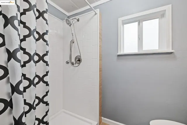 a bathroom with a shower curtain