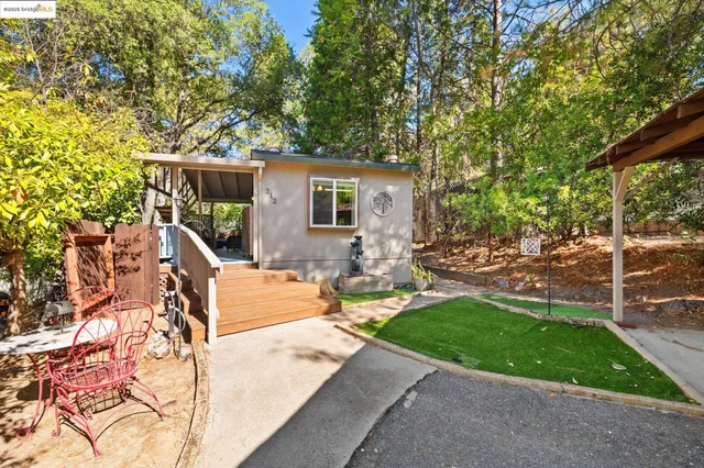 a view of a backyard with sitting area