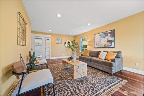 a living room with furniture and a rug