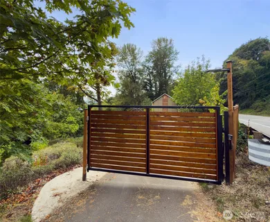 a view of a house with a tree