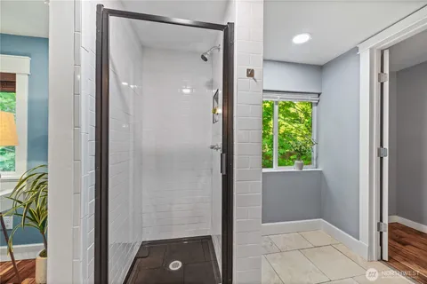 a view of bathroom with shower and garden