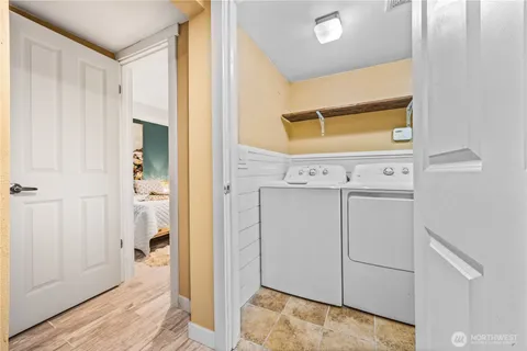 a view of a hallway with bathroom