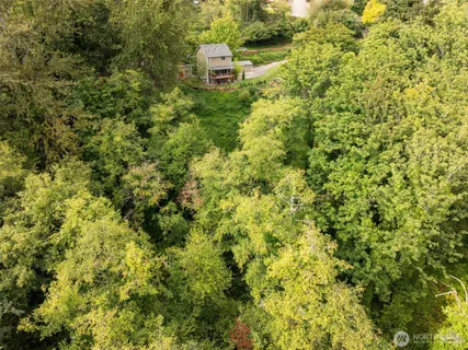 a view of a house with a tree
