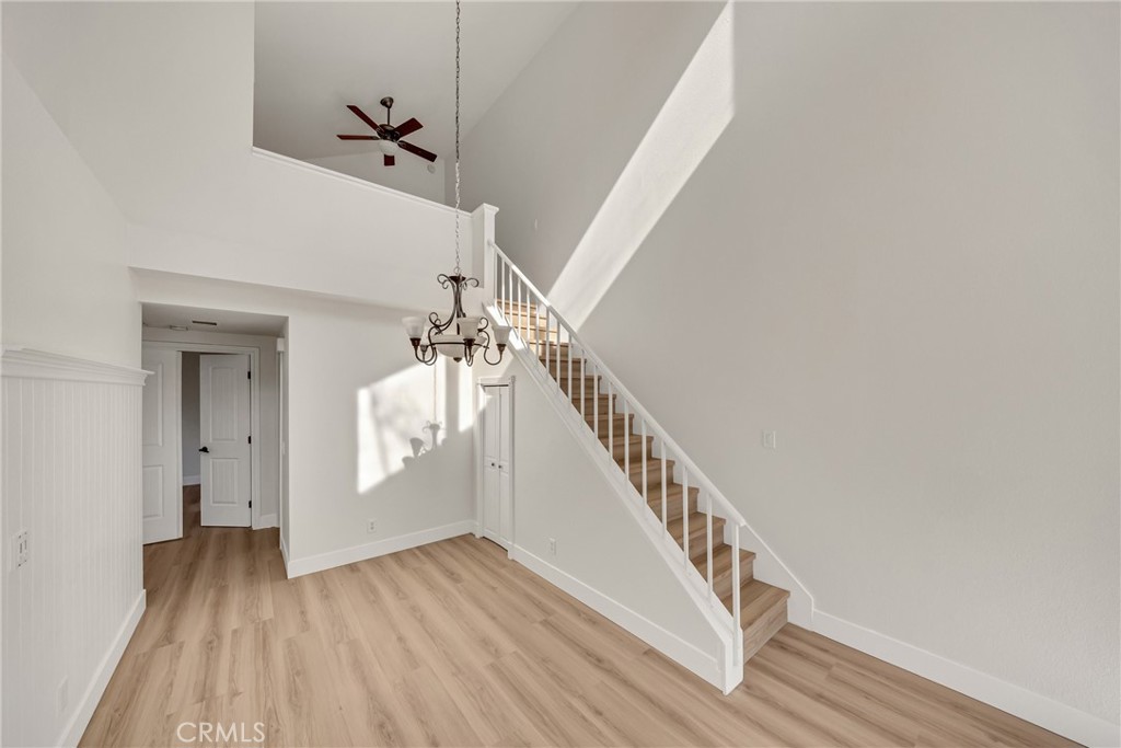 21146 Sunny Ridge Lake Forest, CA 92630 - Photo 16 of 43 a view of a hallway with wooden floor and staircase