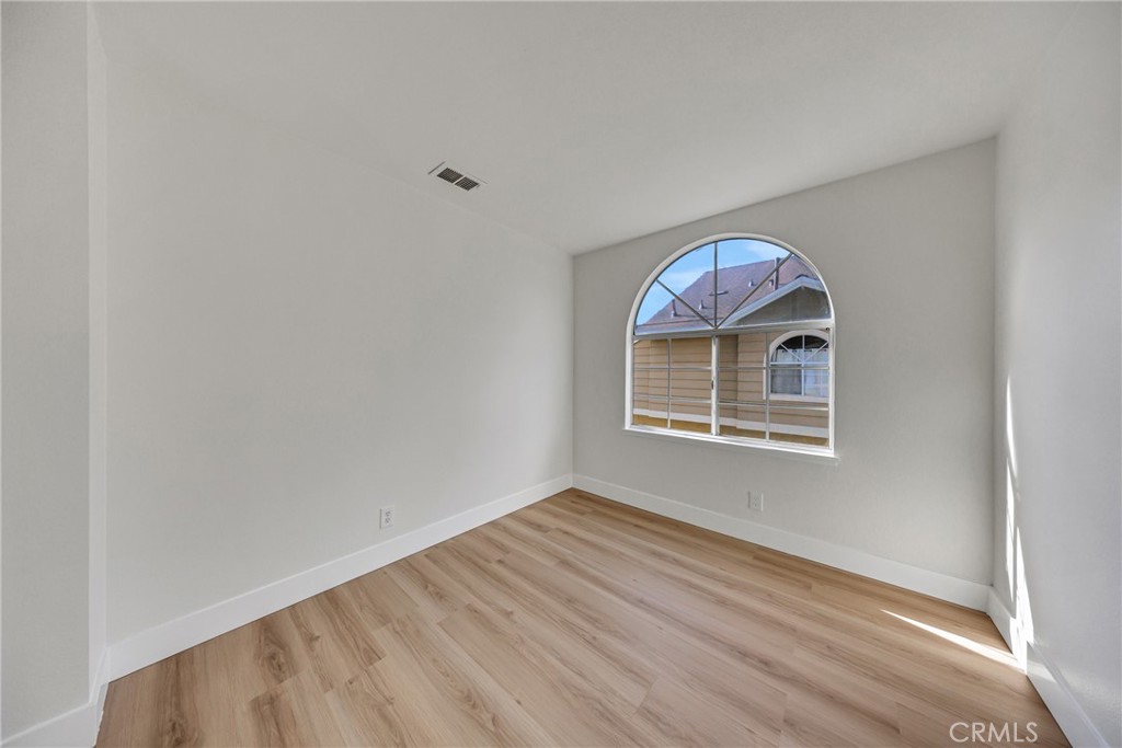 21146 Sunny Ridge Lake Forest, CA 92630 - Photo 28 of 43 a room with a wooden floor and natural light