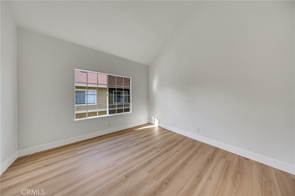 21146 Sunny Ridge Lake Forest, CA 92630 - Photo 30 of 43 a view of an empty room with wooden floor and a window