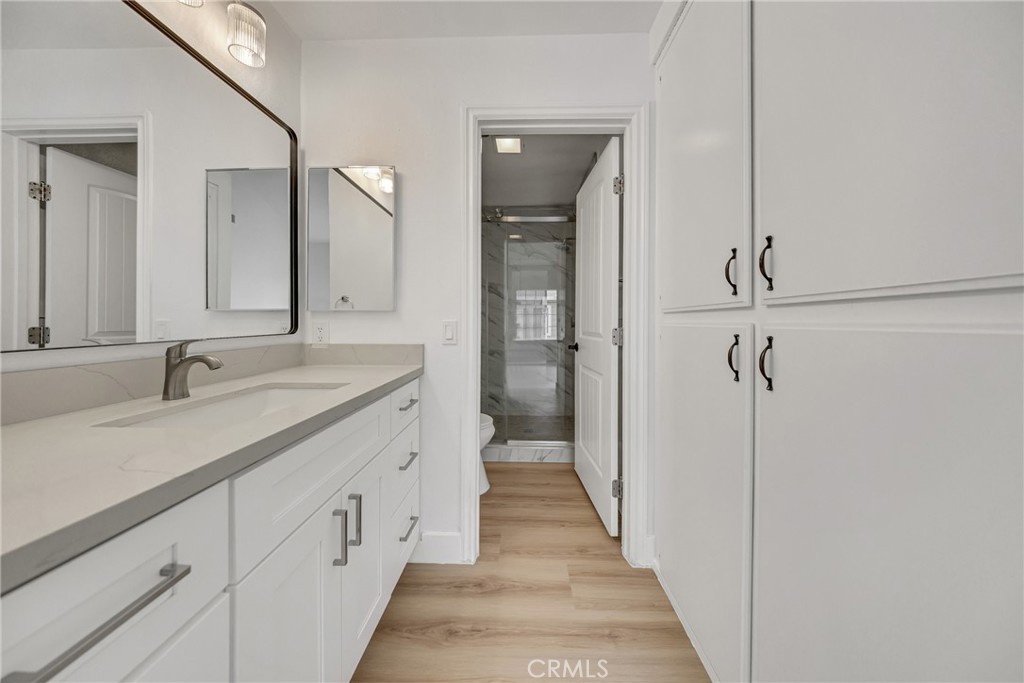 21146 Sunny Ridge Lake Forest, CA 92630 - Photo 33 of 43 a spacious bathroom with a double vanity sink and mirror