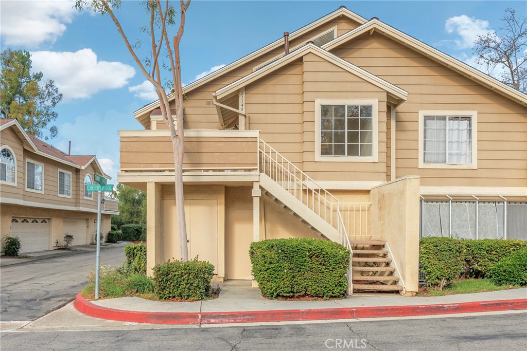 21146 Sunny Ridge Lake Forest, CA 92630 - Photo 35 of 43 a view of a white house next to a yard