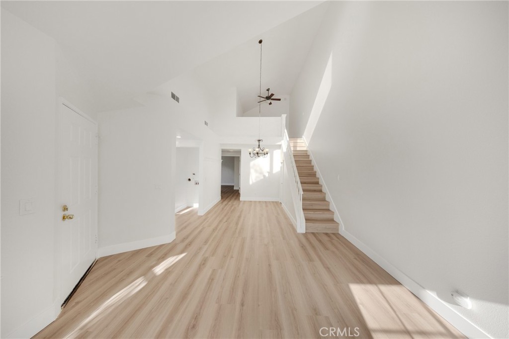 21146 Sunny Ridge Lake Forest, CA 92630 - Photo 7 of 43 a view of a hallway with wooden floor and staircase