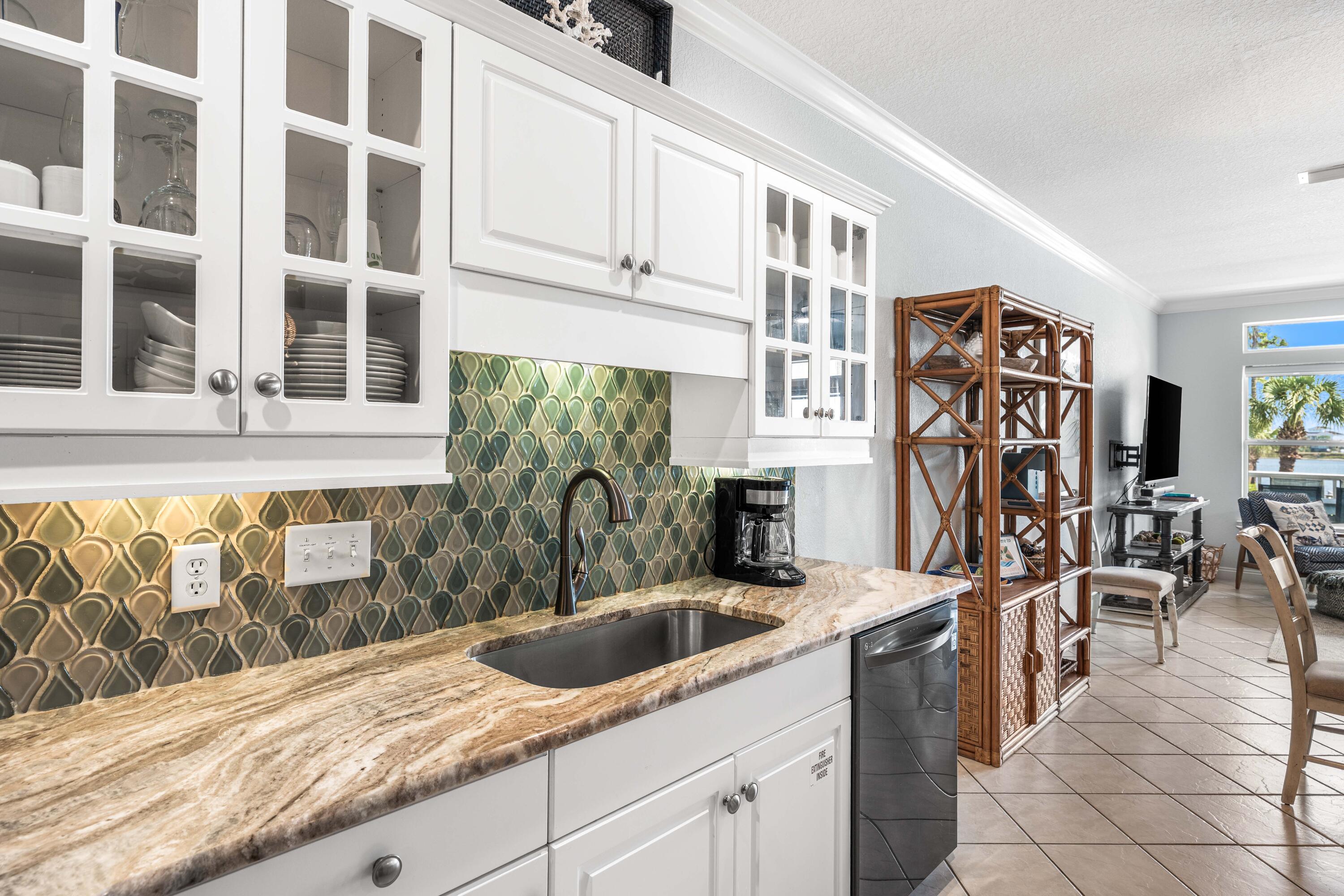 33 Dune Breeze Lane, Unit H2 Santa Rosa Beach, FL 32459 - Photo 7 of 54 a kitchen with stainless steel appliances granite countertop a sink and a cabinets