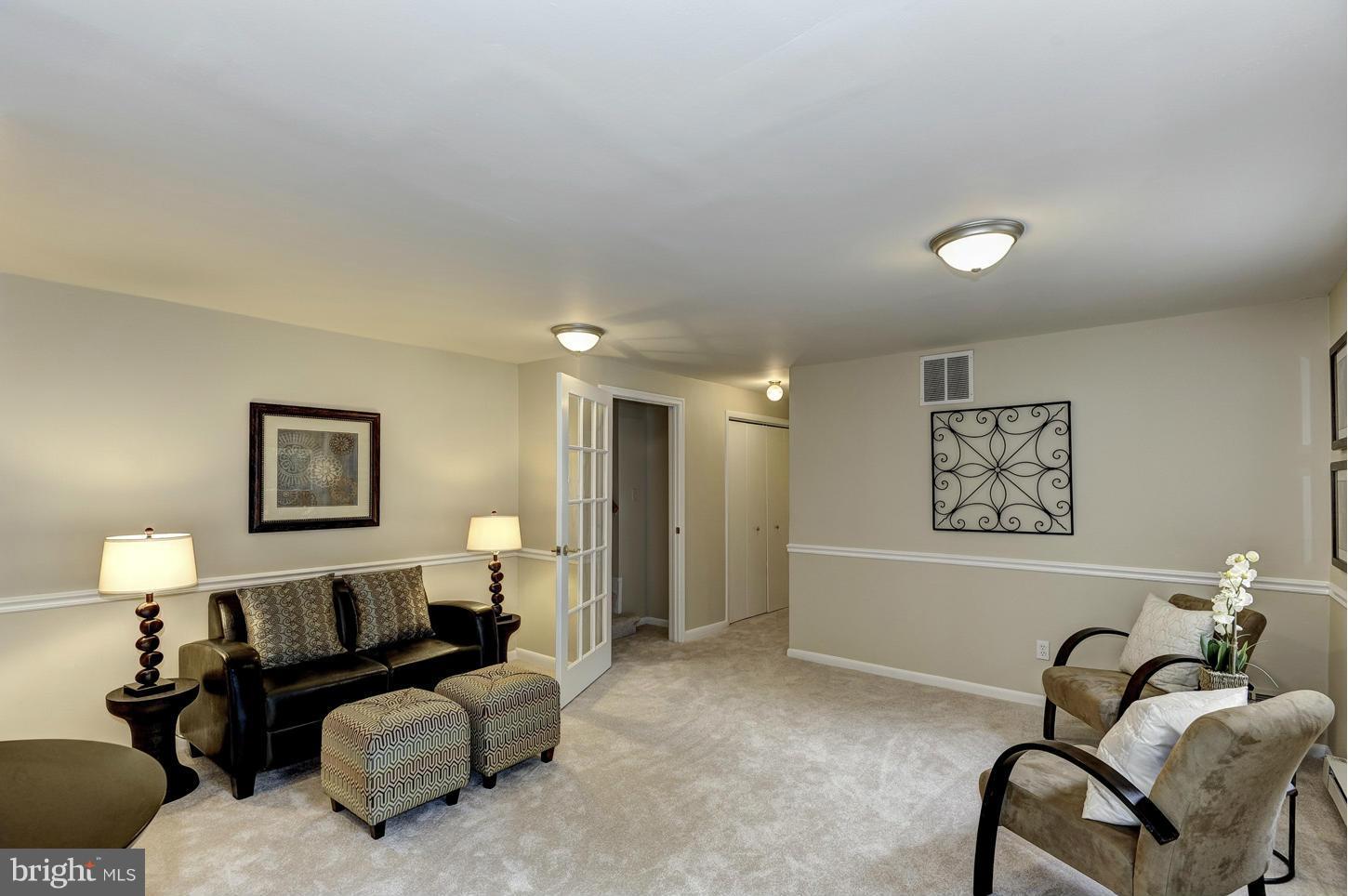 8016 Karl Road Alexandria, VA 22308 - Photo 14 of 22 a living room with furniture and a lamp